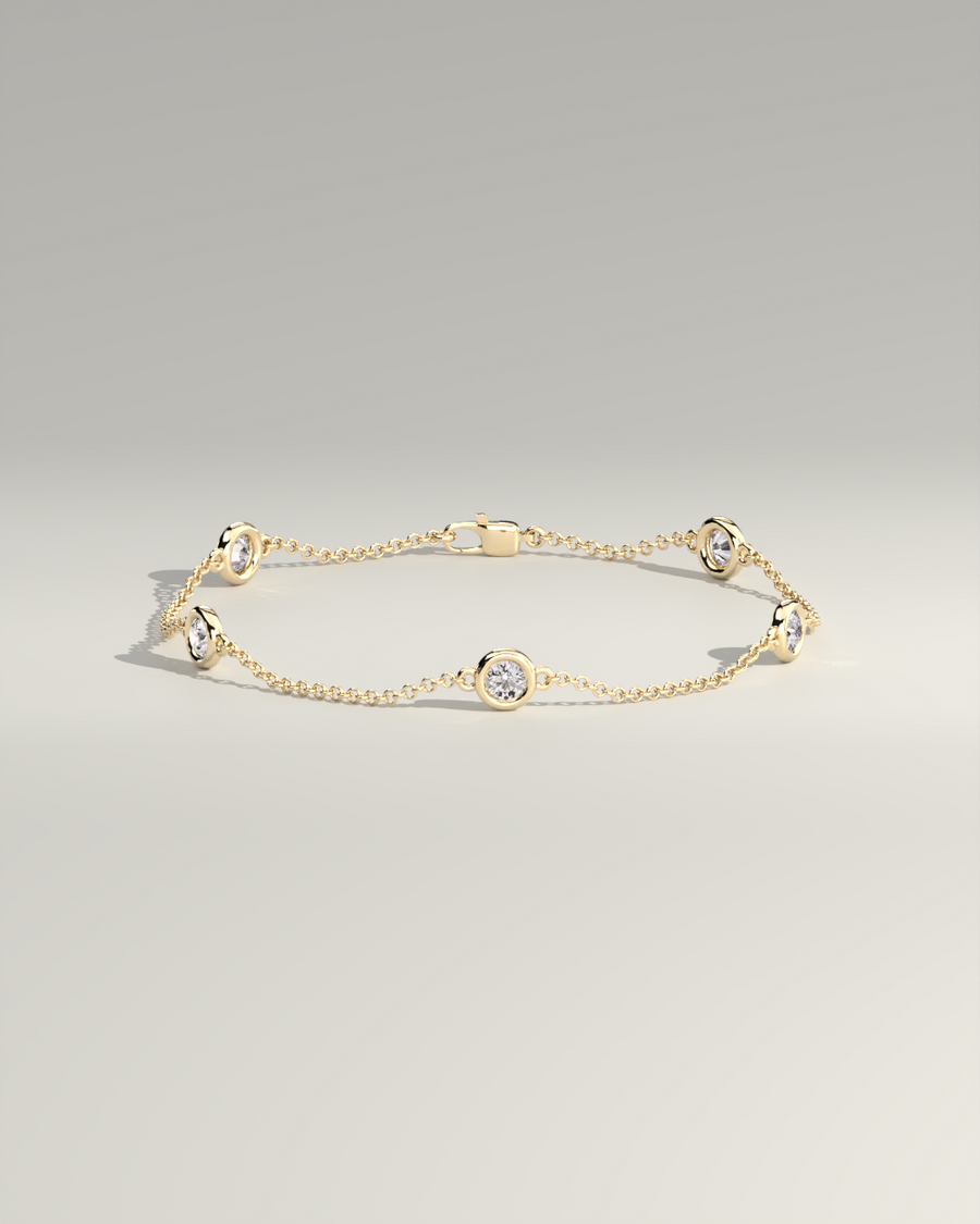 Diyona 1 carat round diamond bezel station bracelet in yellow gold — closed loop