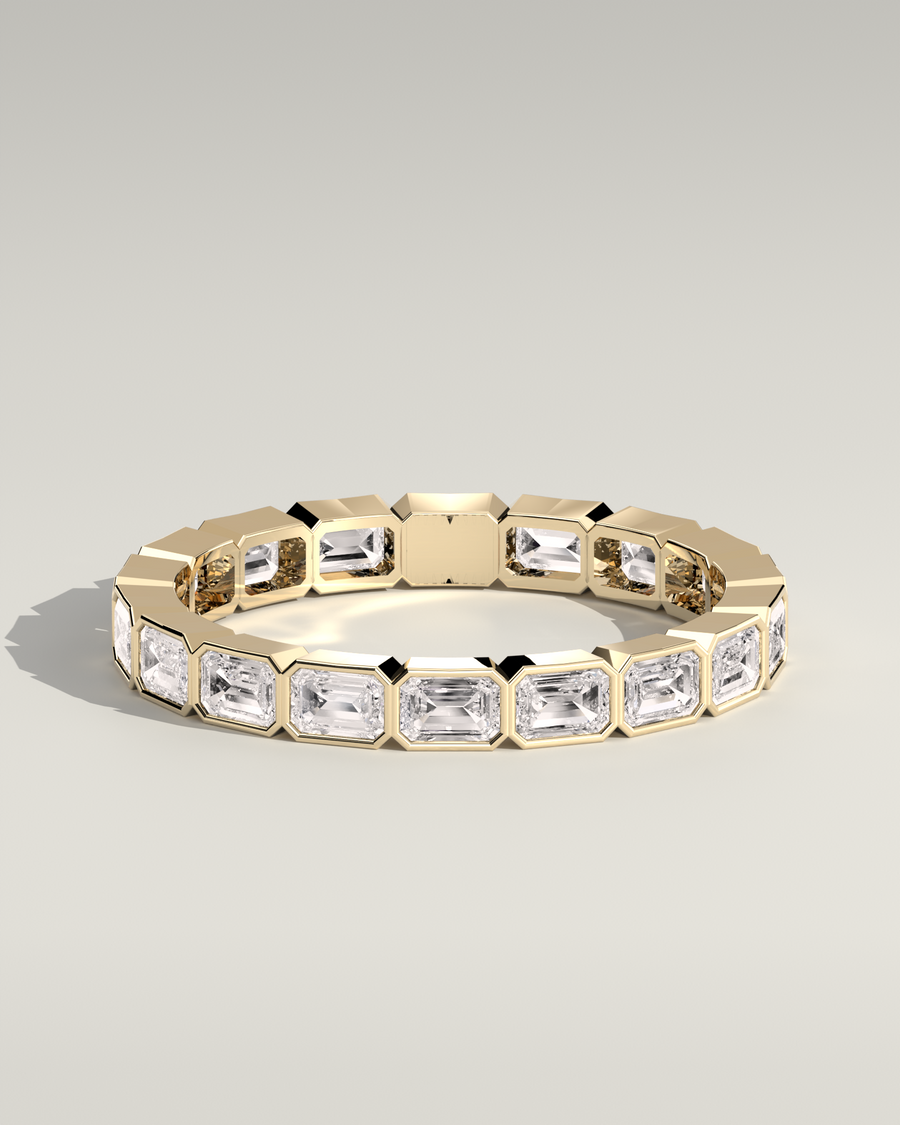 East-West Emerald Bezel Eternity in 14K Yellow Gold — Diyona